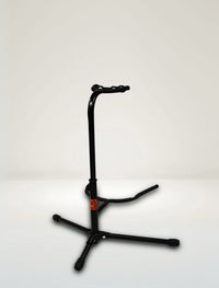 A black single guitar stand with a smart locking mechanism and red safety feet, designed for supporting electric or acoustic guitars.