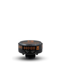 Black and orange valve stem cap on a white background